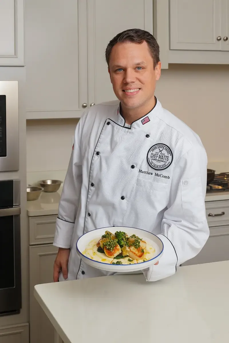 Chef Matt McComb plating a course during in-home private chef service
