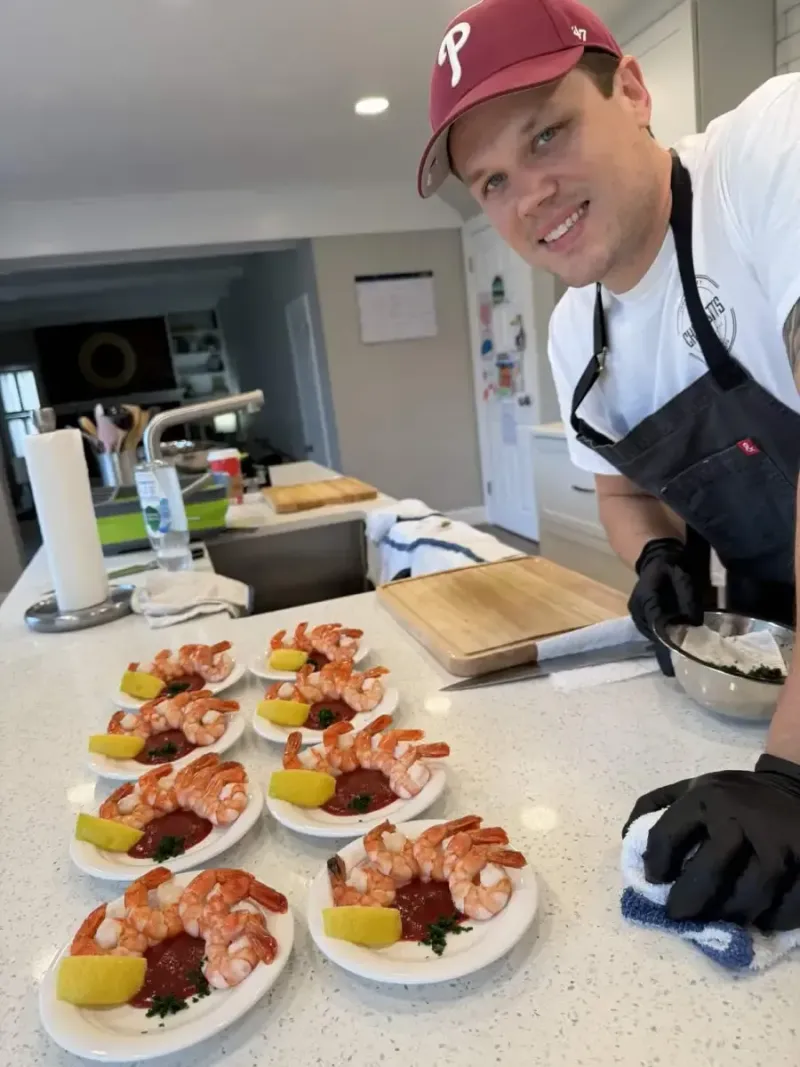 Chef Matt plating shrimp appetizers during private chef service
