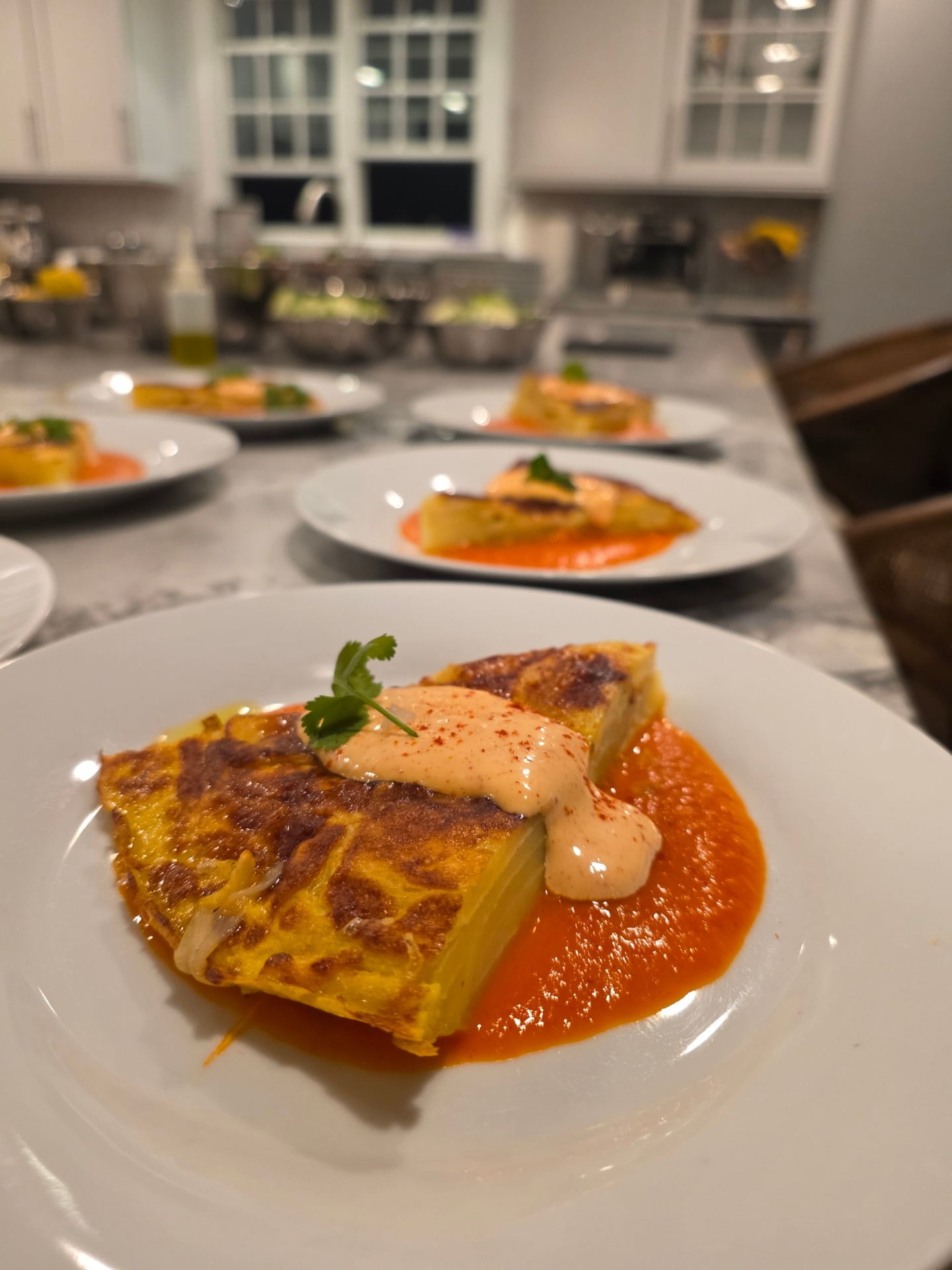 Spanish tortilla with romesco sauce and chipotle aioli plated for a private dinner party
