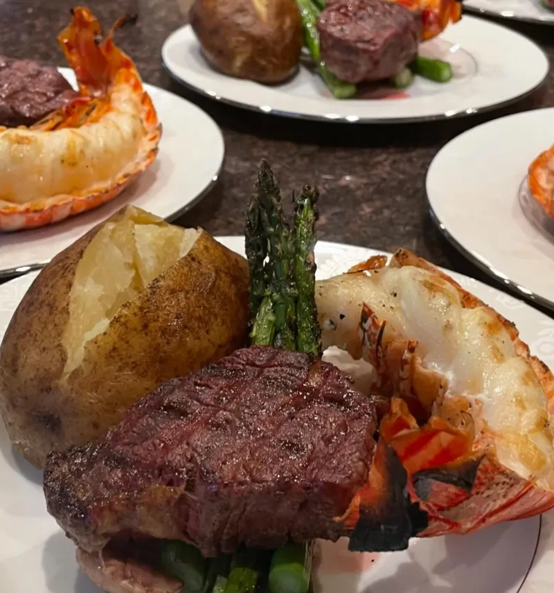 Steak and lobster plated for a private dinner